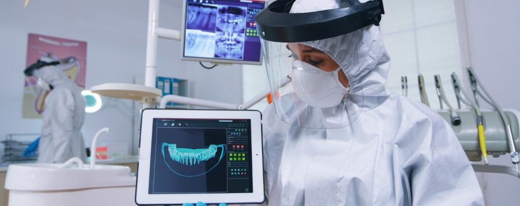 Patient interacting with augmented reality smile simulation screen.